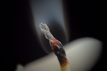 Close-up of a smoldering wick - Alamy photo - Used under license